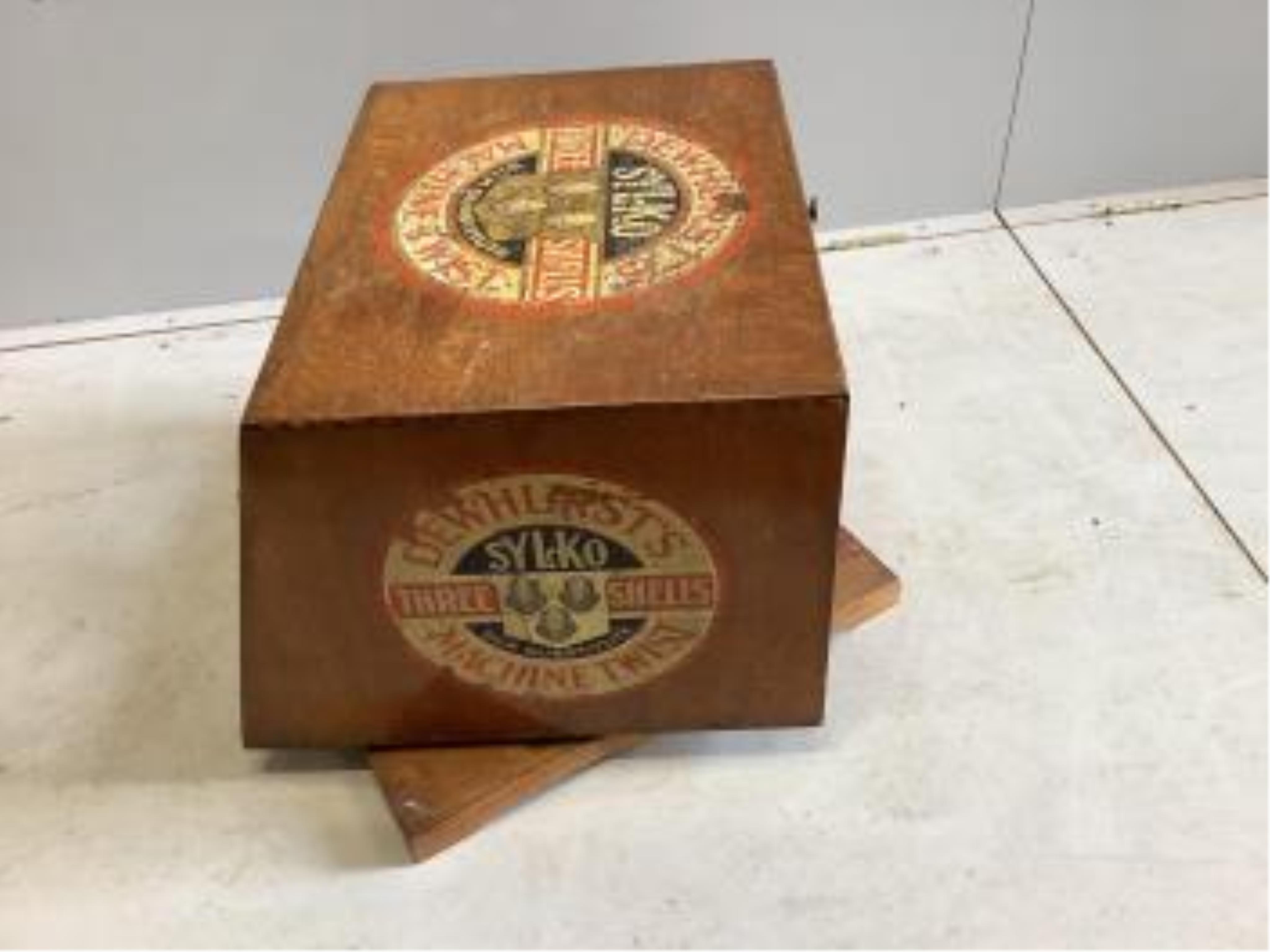 An early 20th century oak counter top display case, 'Dewhursts Sylko three shells machine twist' on revolving base, width 54cm, depth 53cm, height 43cm. Condition - fair